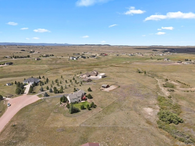 birds eye view of property featuring a rural view