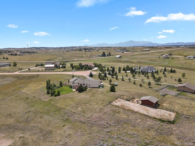 drone / aerial view with a mountain view and a rural view