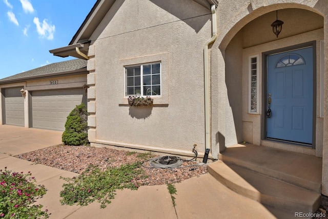 property entrance with a garage