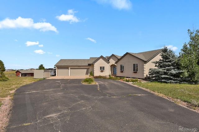 view of front of property featuring a garage