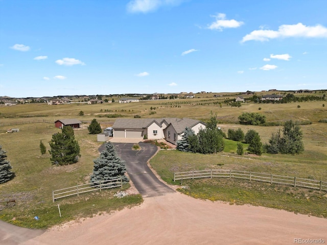 birds eye view of property featuring a rural view