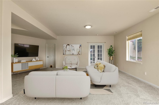 living room featuring french doors and light colored carpet