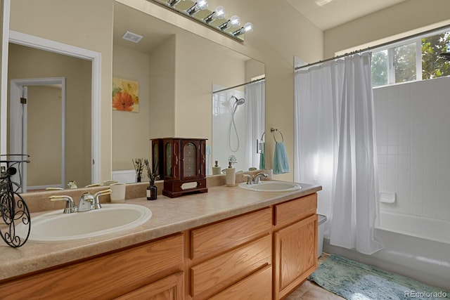 bathroom featuring vanity, tile patterned floors, and shower / tub combo with curtain