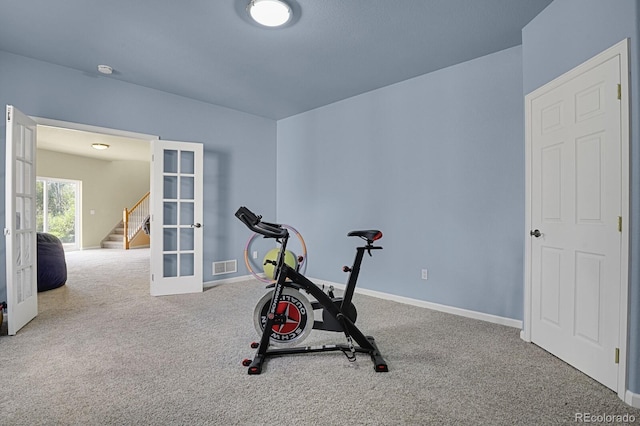 workout room with french doors and carpet flooring