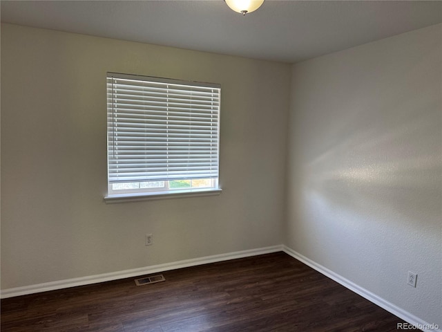 13959 Eudora St, Thornton, CO 80602 - empty room featuring dark wood-type flooring and baseboards