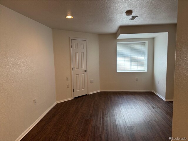 13959 Eudora St, Thornton, CO 80602 - spare room with dark wood-type flooring and baseboards