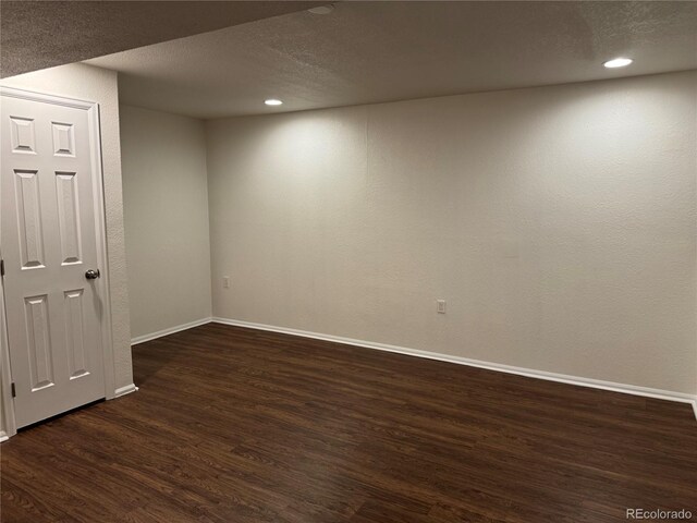 13959 Eudora St, Thornton, CO 80602 - unfurnished room featuring dark wood-style flooring, baseboards, a textured ceiling, and recessed lighting