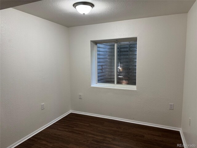 13959 Eudora St, Thornton, CO 80602 - empty room with wood finished floors and baseboards