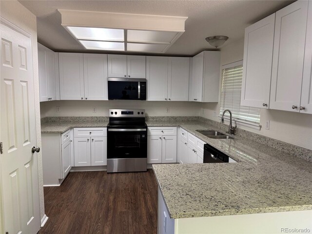 13959 Eudora St, Thornton, CO 80602 - kitchen featuring appliances with stainless steel finishes, a sink, dark wood-style flooring, light stone counters, and white cabinets