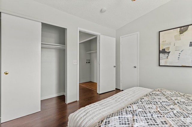 8260 Washington St Unit 78, Denver, CO 80229 - bedroom featuring wood finished floors, a closet, and a textured ceiling