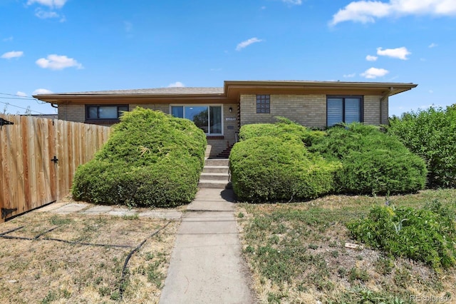 10595 E 23rd Ave, Aurora, CO 80010 - view of front of house featuring brick siding