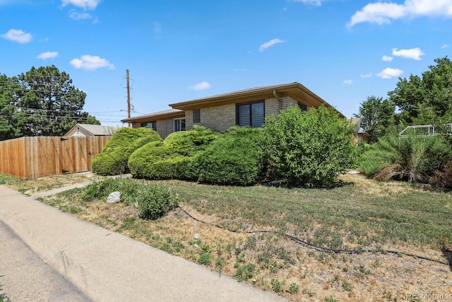10595 E 23rd Ave, Aurora, CO 80010 - view of side of home with brick siding