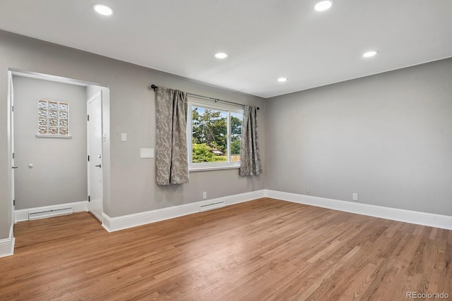 10595 E 23rd Ave, Aurora, CO 80010 - spare room with wood finished floors and recessed lighting