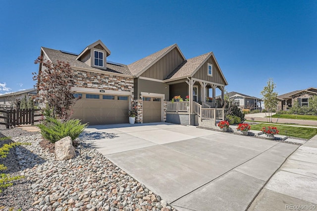 view of front of house featuring a garage and a porch