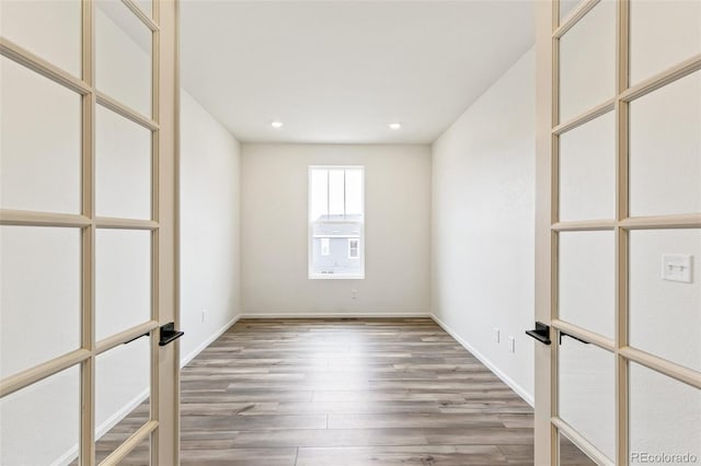 empty room featuring hardwood / wood-style flooring