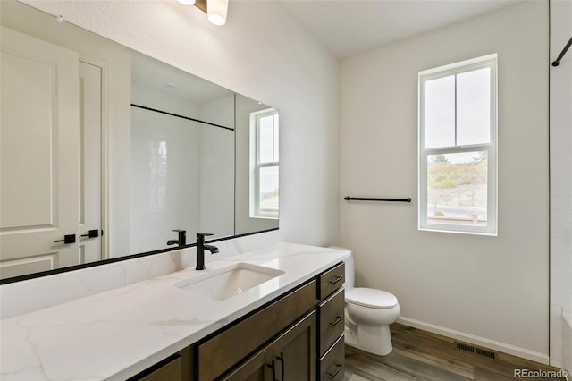 full bathroom with vanity, toilet, shower / bath combination, and hardwood / wood-style floors