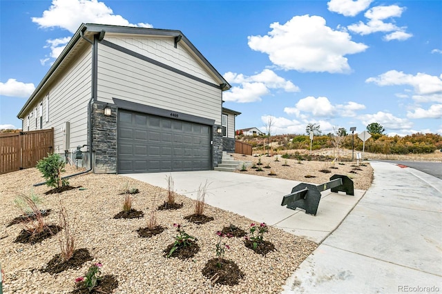 view of side of property with a garage