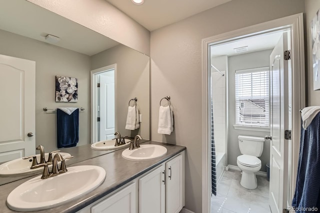 14067 Hudson St, Thornton, CO 80602 - bathroom with double vanity, toilet, shower / tub combo, and tile patterned floors