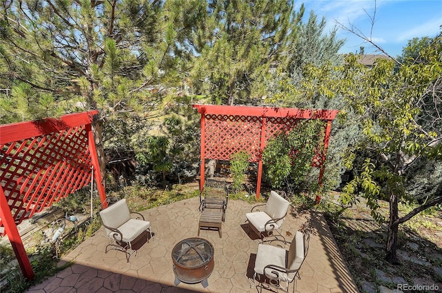 view of patio featuring an outdoor fire pit