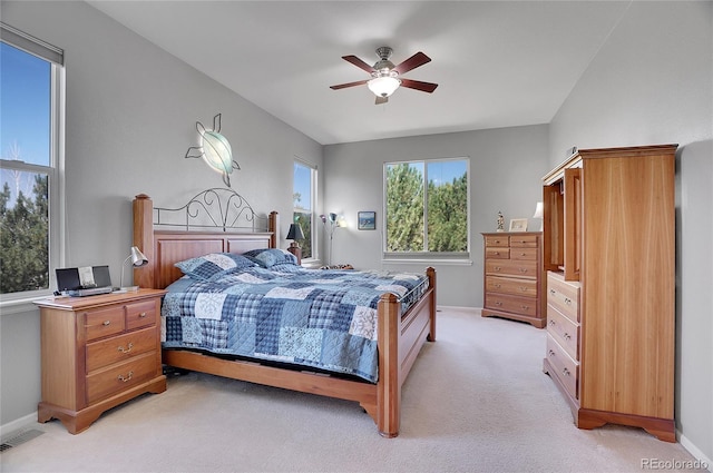 bedroom featuring light carpet, baseboards, visible vents, and a ceiling fan