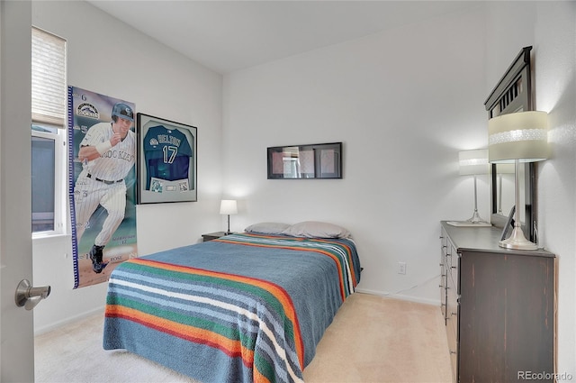 bedroom with carpet floors and baseboards