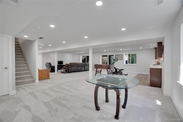 game room with light carpet and sink