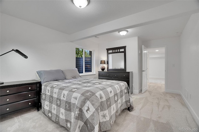 bedroom featuring light colored carpet