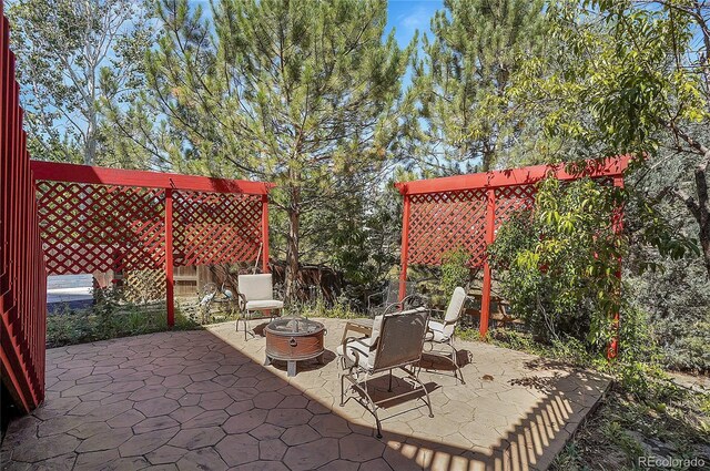 view of patio with an outdoor fire pit