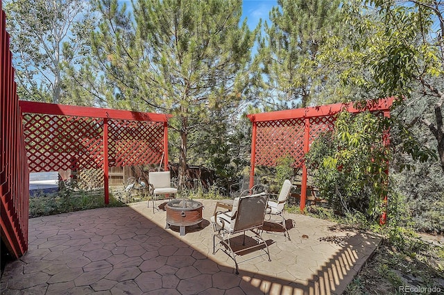 view of patio / terrace with a fire pit