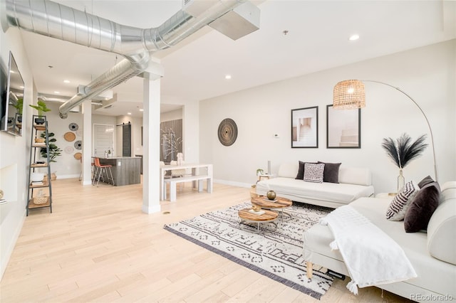 living room with light hardwood / wood-style flooring