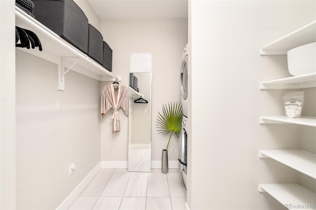 bathroom with washer / dryer and tile patterned floors