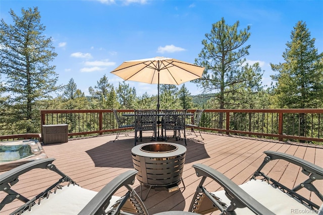 6252 King Dr, Evergreen, CO 80439 - deck with outdoor dining area and an outdoor fire pit
