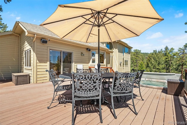 6252 King Dr, Evergreen, CO 80439 - wooden deck with outdoor dining area and a pool