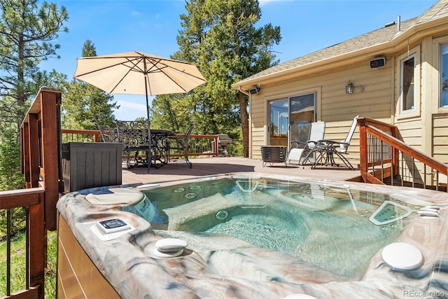 6252 King Dr, Evergreen, CO 80439 - view of pool featuring a hot tub, a deck, and outdoor dining space