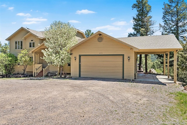 6252 King Dr, Evergreen, CO 80439 - view of front facade featuring an attached garage, driveway, and roof with shingles