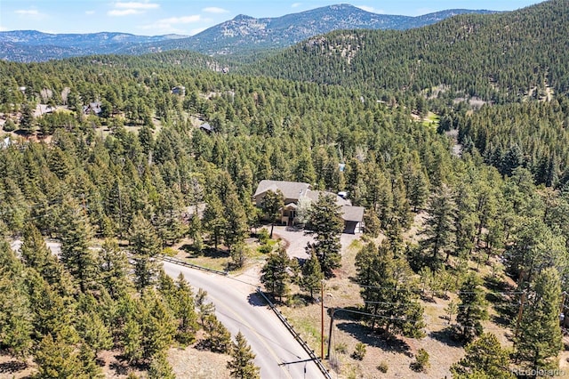 6252 King Dr, Evergreen, CO 80439 - aerial view of a forest and a mountain backdrop