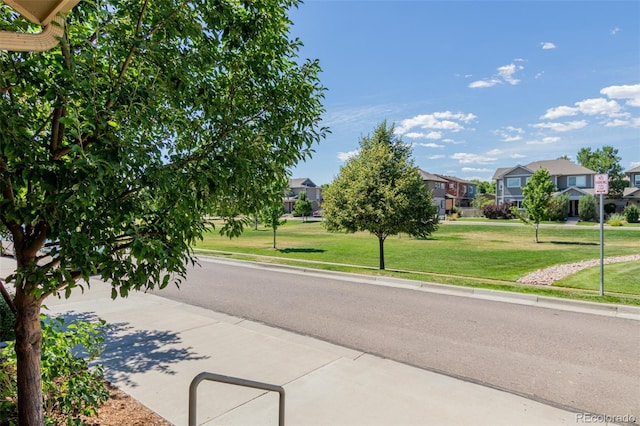 332 N Parkside Dr Unit C, Longmont, CO 80501 - view of asphalt road with a residential view, curbs, and sidewalks