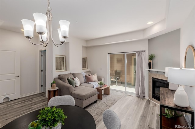 332 N Parkside Dr Unit C, Longmont, CO 80501 - living room with light wood-type flooring, recessed lighting, a fireplace, and a chandelier