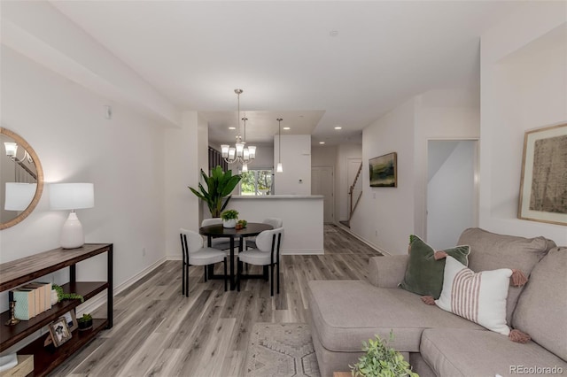 332 N Parkside Dr Unit C, Longmont, CO 80501 - living area featuring a chandelier, light wood-style floors, and recessed lighting