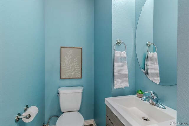 332 N Parkside Dr Unit C, Longmont, CO 80501 - half bathroom featuring toilet and vanity