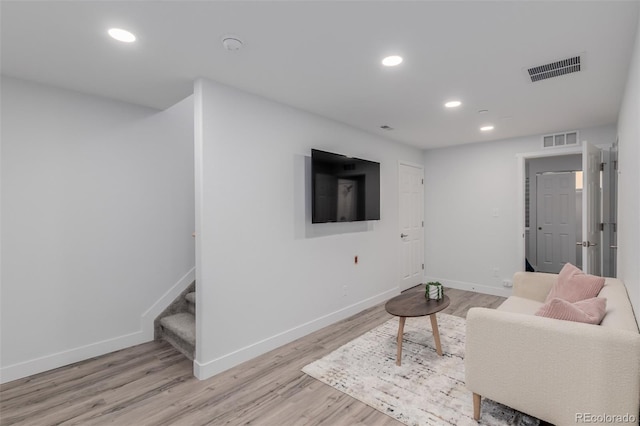 332 N Parkside Dr Unit C, Longmont, CO 80501 - living area with stairway, light wood-style floors, and recessed lighting