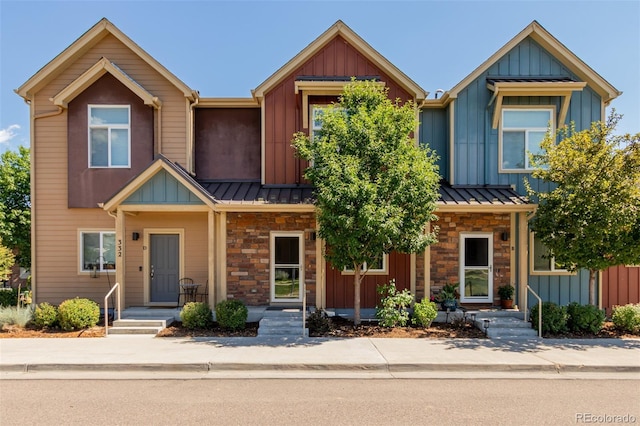 332 N Parkside Dr Unit C, Longmont, CO 80501 - townhome / multi-family property with a standing seam roof, board and batten siding, stone siding, and a metal roof