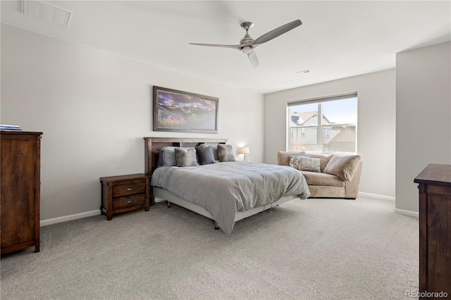 bedroom featuring light carpet and ceiling fan