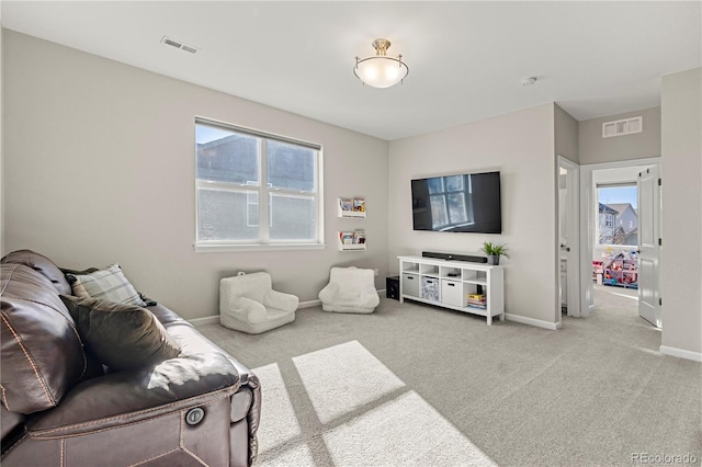 living room featuring plenty of natural light and carpet