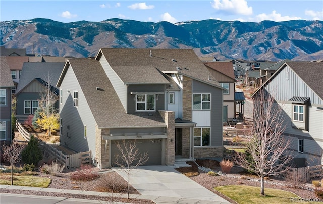 view of front of home featuring a garage and a mountain view