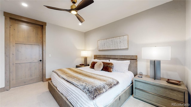 carpeted bedroom featuring ceiling fan