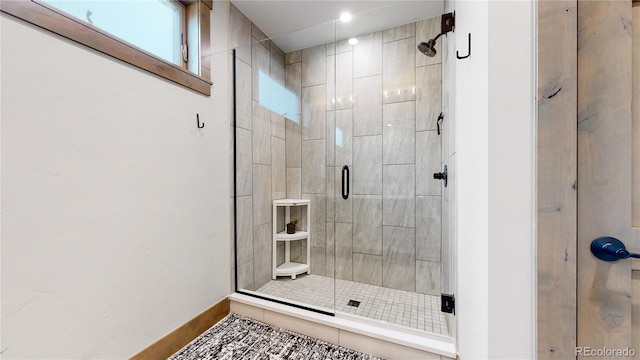 bathroom featuring tile patterned flooring and walk in shower