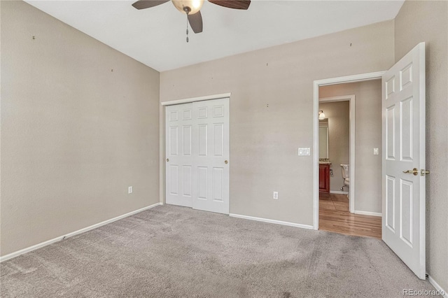 unfurnished bedroom featuring a closet, baseboards, and carpet floors