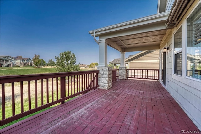 wooden terrace with a yard