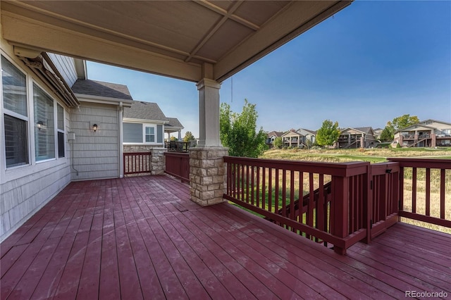 wooden terrace with a residential view